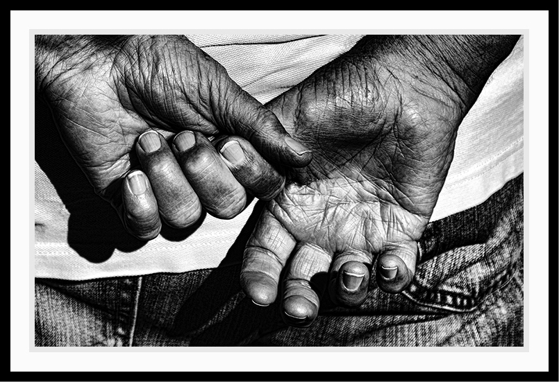 Hands showing wrinkles in black and white.